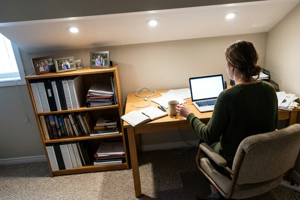 Basement home office nook lit by three potlights in Willowdale