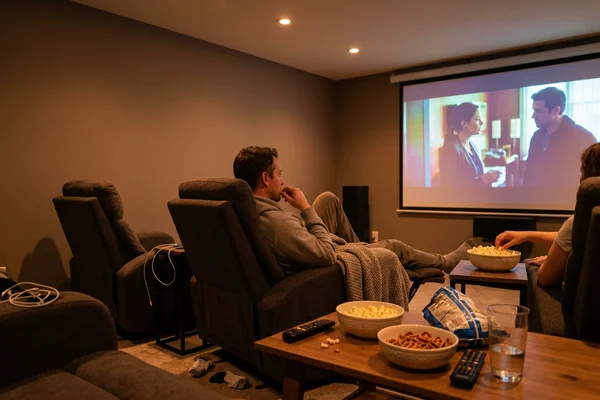 Home theatre with smart potlights dimmed to amber