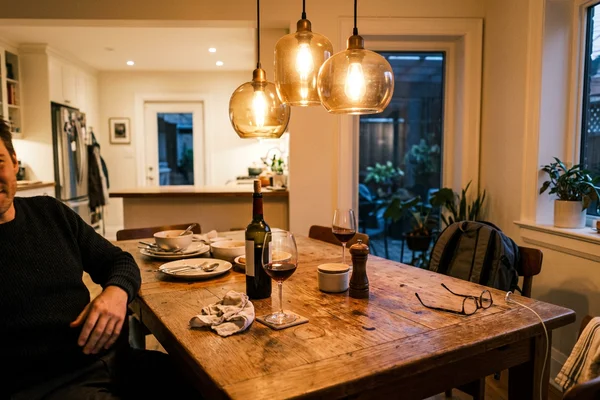 Pendant cluster over a dining table in Leslieville