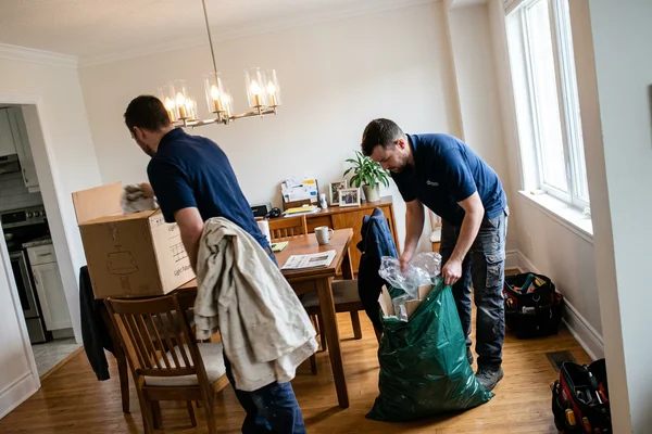 Drop cloths and packaging cleared after a chandelier swap