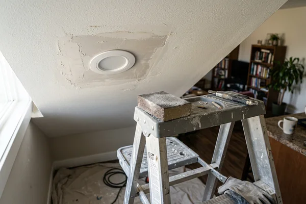 Drywall patch around a new LED potlight in an oversized old opening