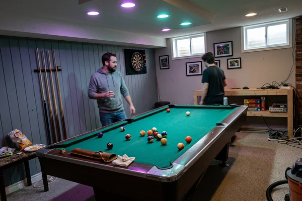 Games room with RGB potlights above a pool table