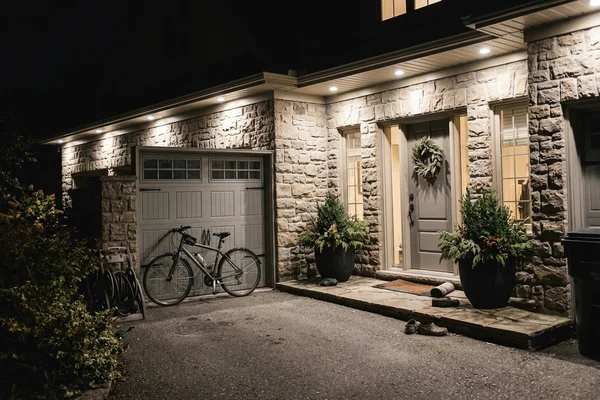 Kleinburg custom home with soffit downlights around the entry