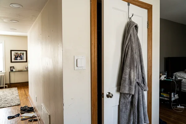 Lutron Caseta Pico remote beside a bedroom door