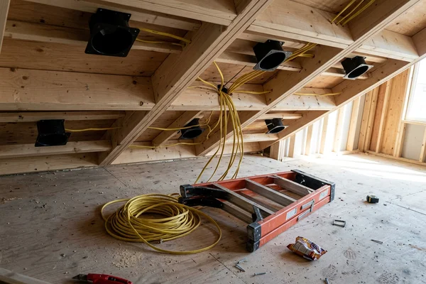 Coffered ceiling framing with potlights roughed in before drywall