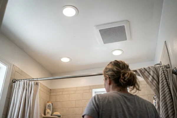 New exhaust fan grille beside bathroom potlights