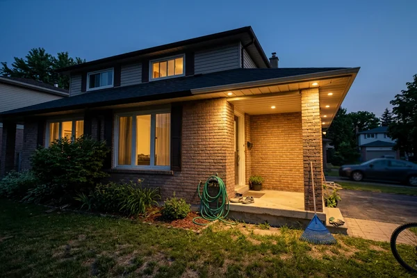 Vaughan house front before and after soffit lighting