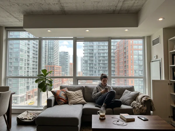 Downtown condo with a drywall bulkhead holding potlights below concrete
